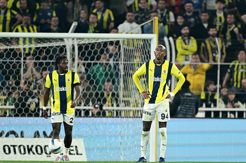 Fenerbahce players react‍ after‍ conceding a goal.